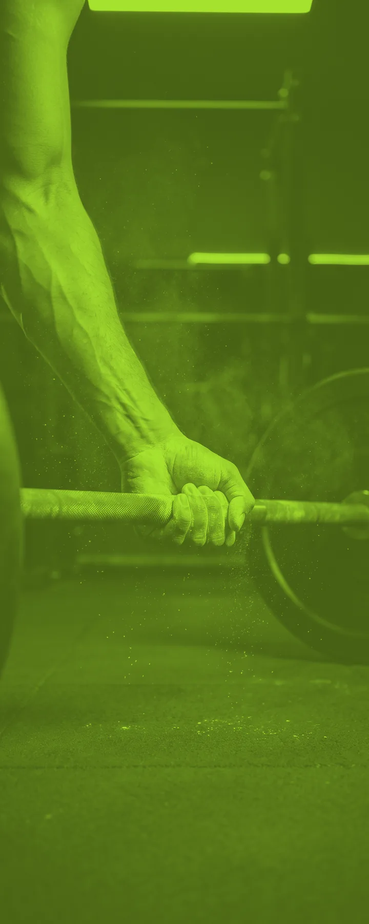 Chalked hands gripping a loaded barbell