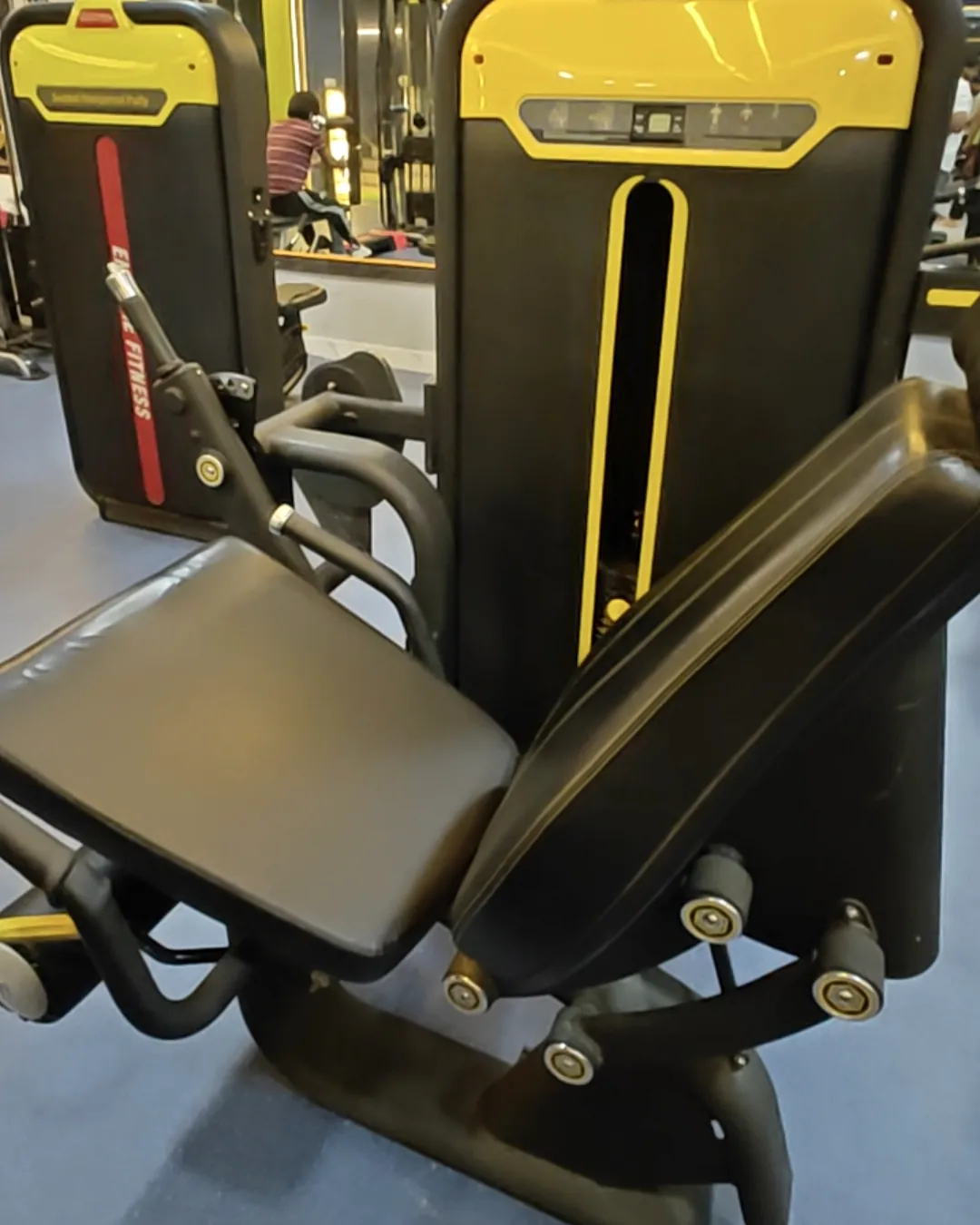 Close-up of a new seated strength machine at Gym-18