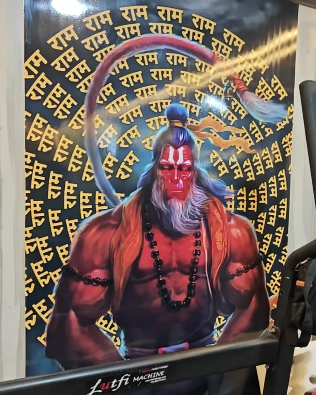 Hanuman wall art above the dumbbell area at Gym-18